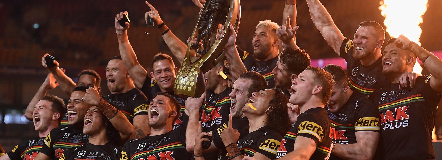 Penrith Panthers hold up the Telstra Premiership trophy.