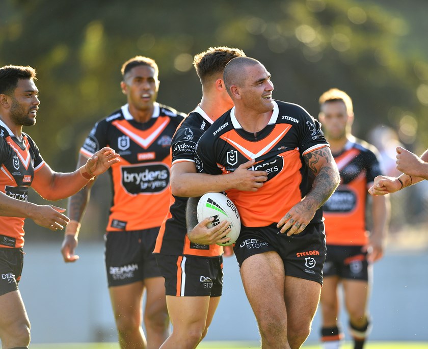 Russell Packer celebrates with teammates during the Tigers' massive trial win over Manly on Sunday.