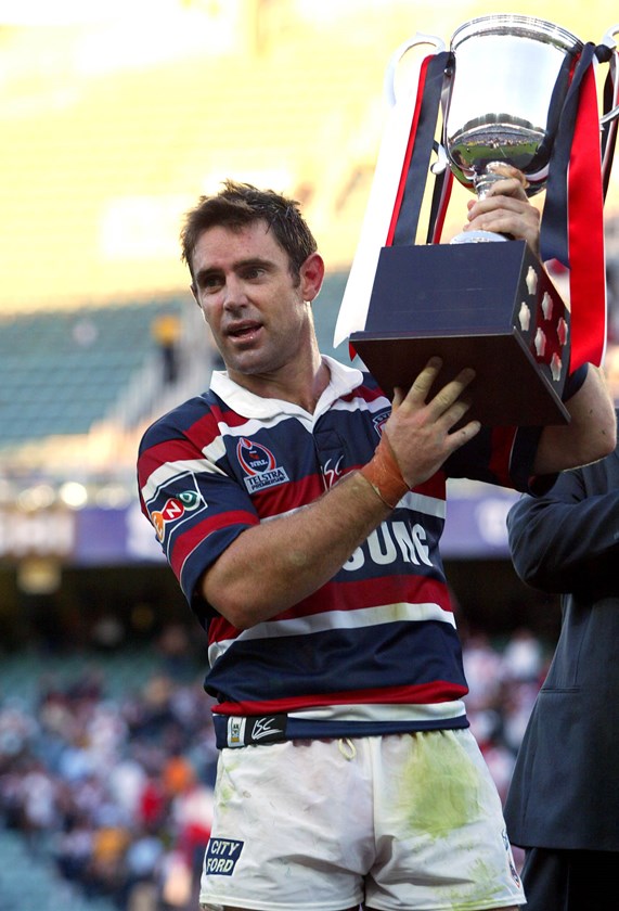 Brad Fittler holds the Anzac Cup after the 2004 encounter.