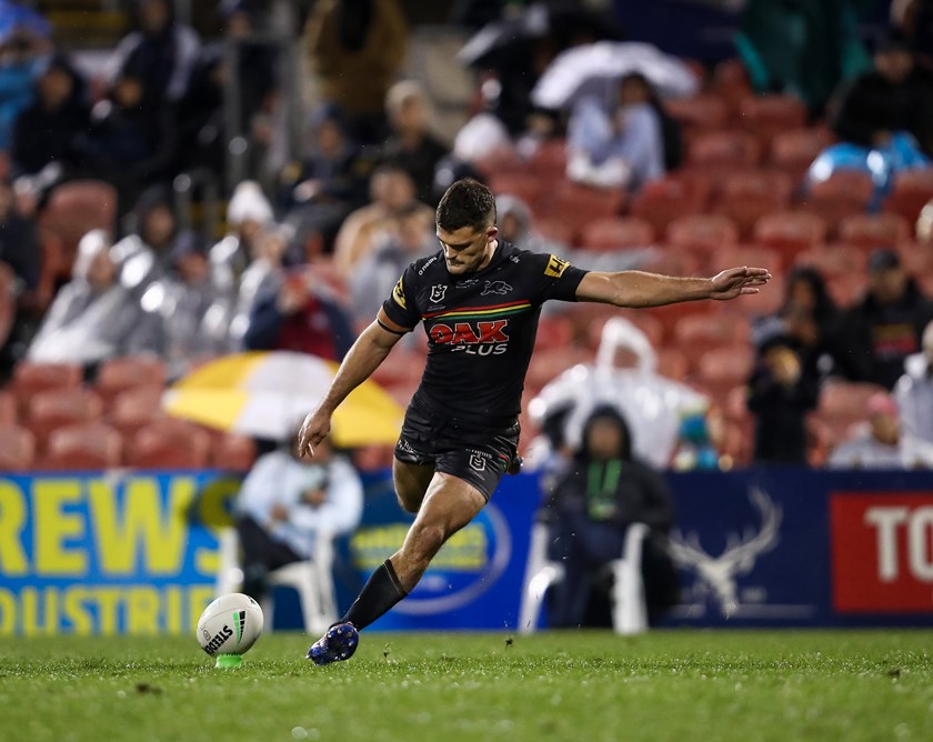 Nathan Cleary strikes a conversion in the rain at BlueBet Stadium.