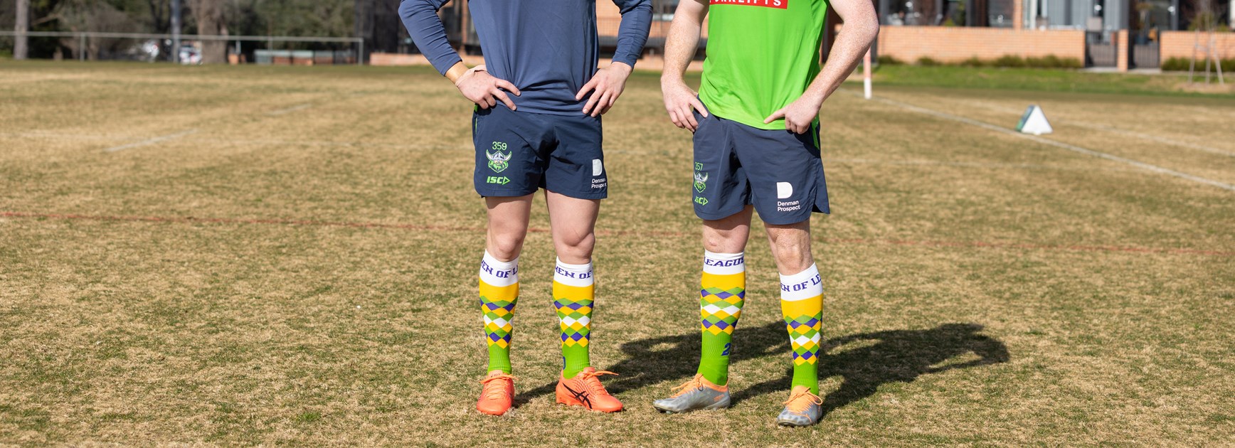 Hudson Young (left) and Corey Horsburgh show off Canberra's Crazy Socks. Credit: Canberra Raiders