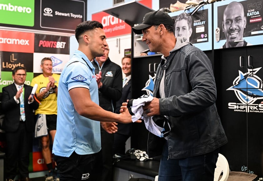 A proud moment for the Iro family in 2022 as dad Kevin presents son KL with his debut Sharks jersey.