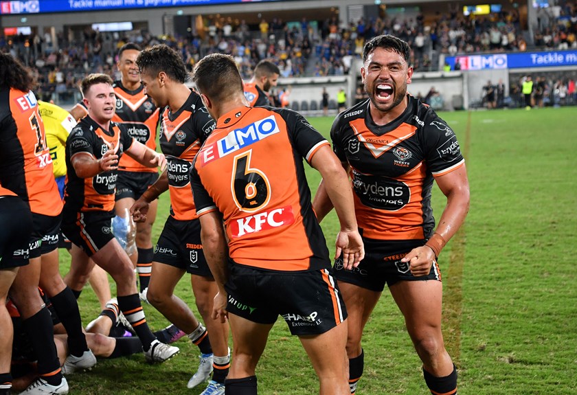 David Nofoaluma and Luke Brooks embrace for the Wests Tigers earlier this year.
