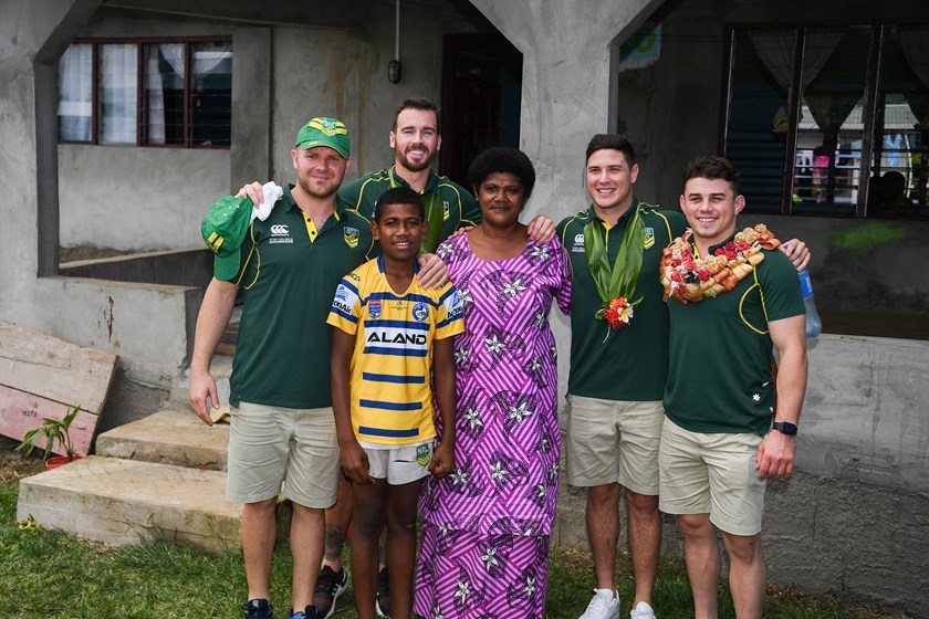 Eels players Nathan Brown, Clint Gutherson, Mitchell Moses and Reed Mahoney with Sivo's mother Mere and late brother Luva at their family village in 2019.