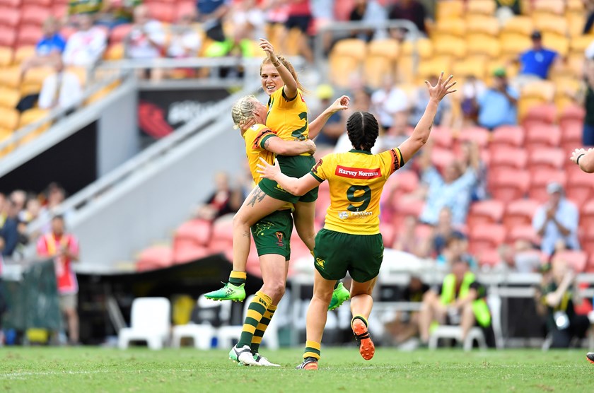 In brighter times: Moran is flocked by Ali Brigginshaw and Brittany Breayley-Nati during the World Cup final in 2017.