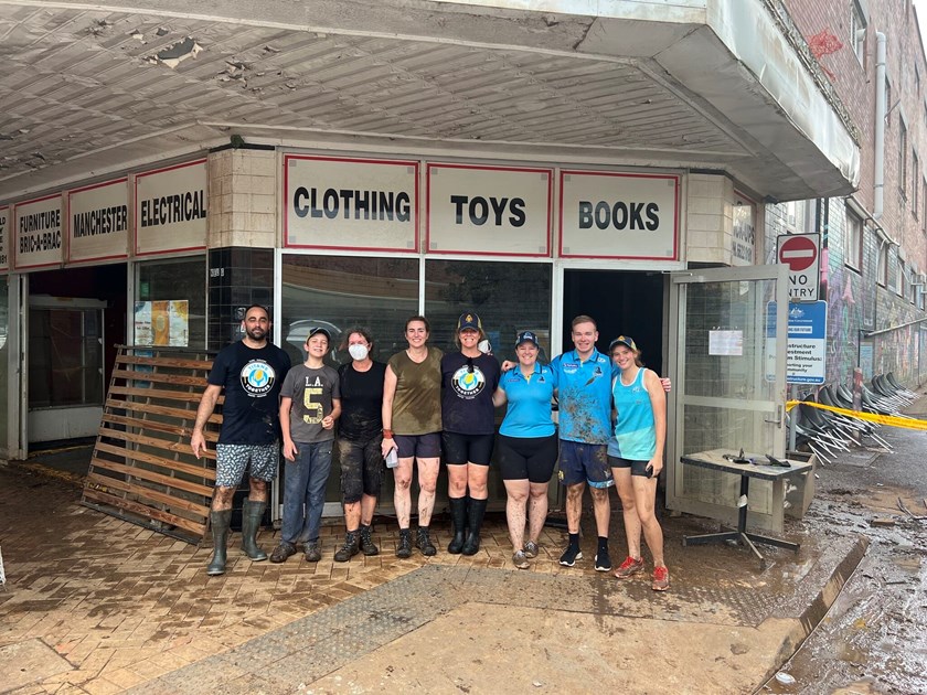 Members of the Titans community team lend a helping hand in Lismore.