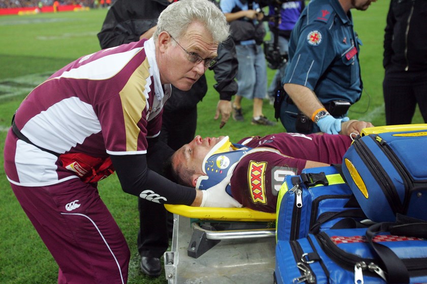 Steve Price is taken from the field at Suncorp Stadium during Game 3, 2009.