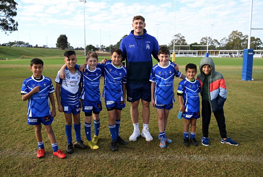 Max King with junior rugby league participants in Kellyville on Wednesday.