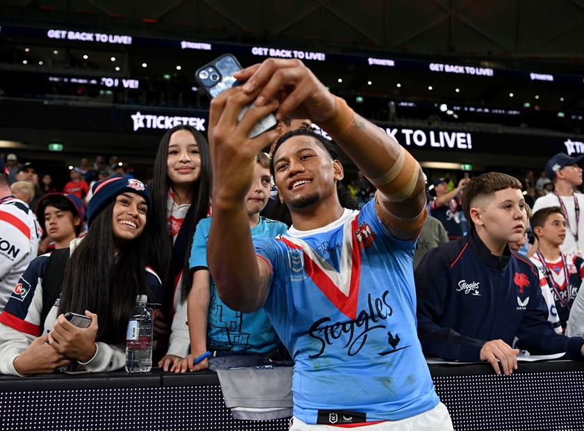 Tupouniua celebrates with fans after making his return from injury in the Anzac Day win over the Dragons. ©NRL Photos