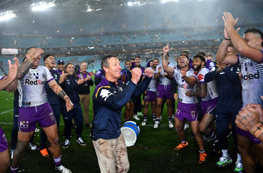 Bellamy and the Storm players celebrate their 2020 grand final triumph