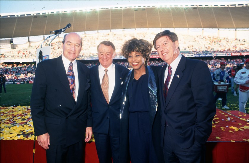 John Quayle (far left) and Ken Arthurson (second from left) on stage with Tina Turner at the 1993 grand final.