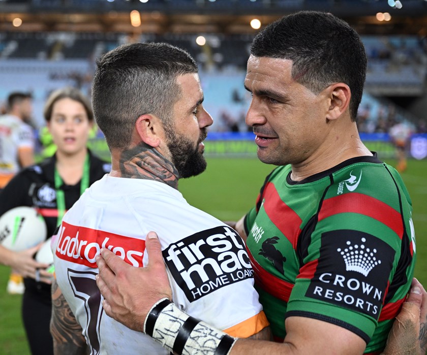 Walker and Reynolds embrace after playing against each other for the first time in 2022