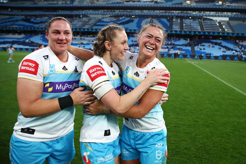 Steph Hancock celebrates the Titans semi-final win with Karina Brown and Niall Williams-Guthrie.