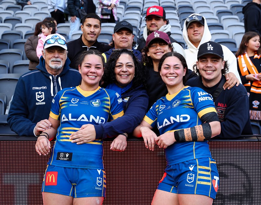 Cherrington sisters Rueben and Kennedy with family after Round 1 at CommBank Stadium.