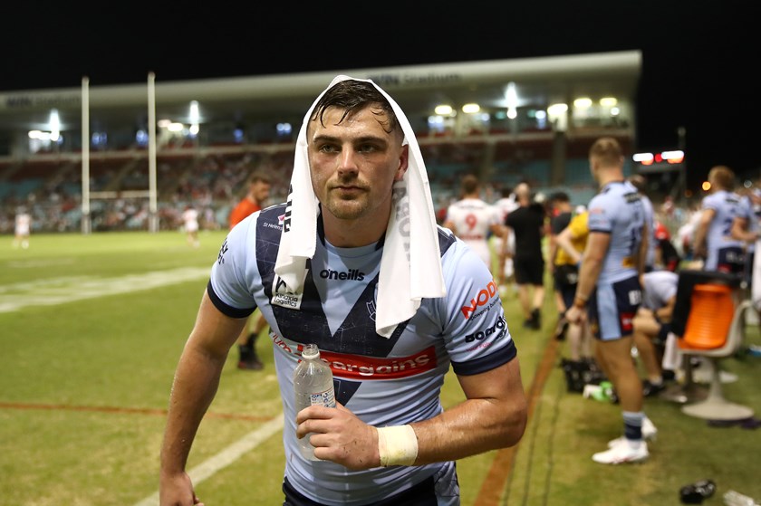 Saints halfback Lewis Dodd cools down during a break against the Dragons 
