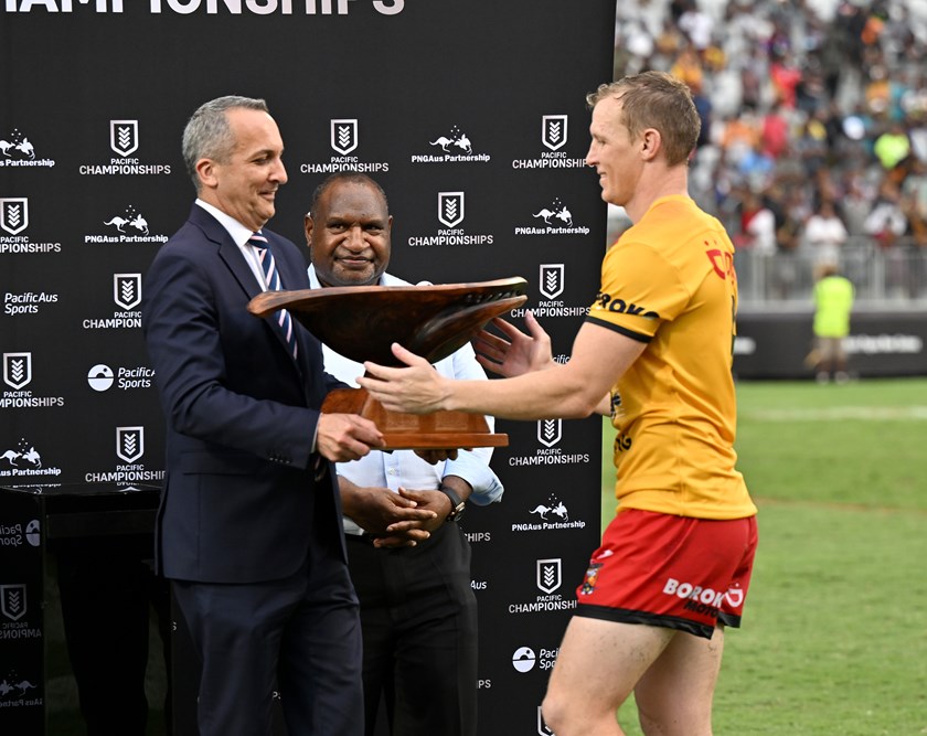 NRL CEO Andrew Abdo presents the Pacific Bowl to Kumuls captain Kyle Laybutt