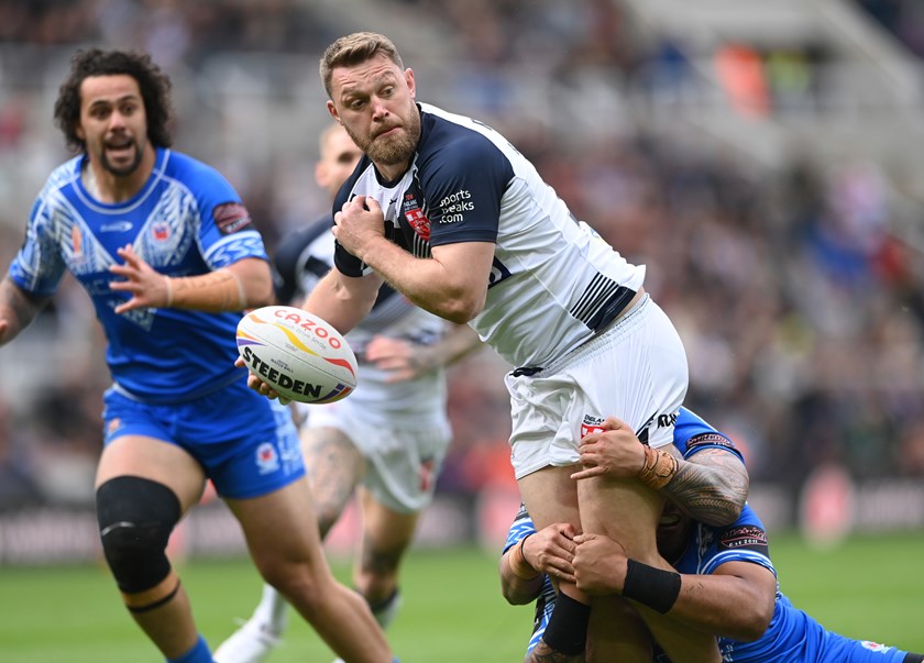Elliott Whiteheads gets an offload away during the 2022 World Cup.