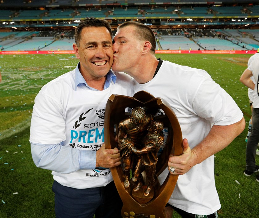 Shane Flanagan and 2016 grand final captain Paul Gallen celebrate the end of Cronulla's premiership drought