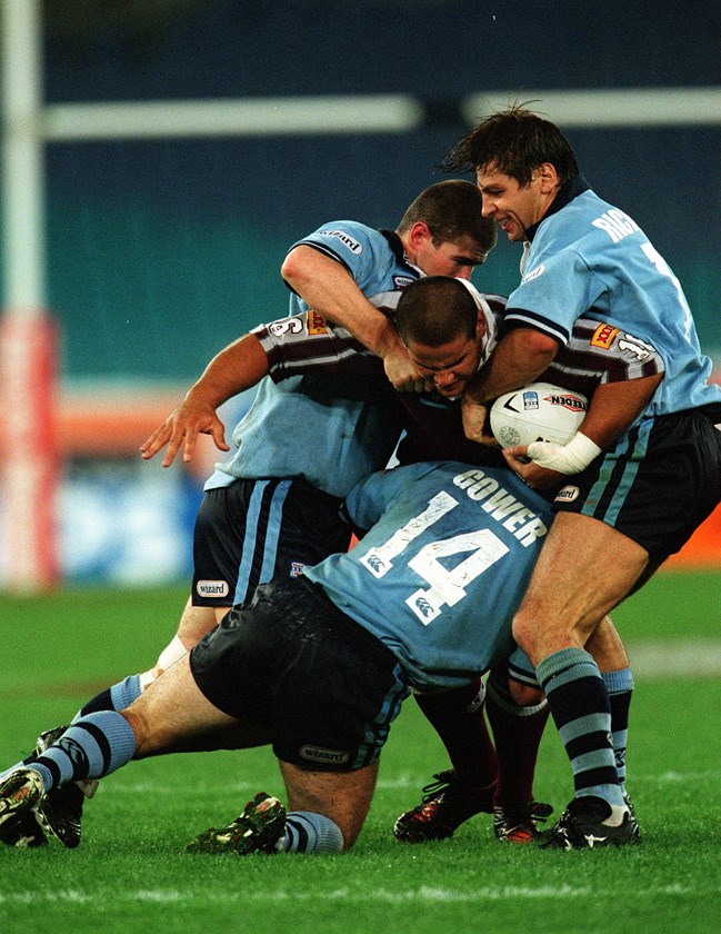Carl Webb takes on the Blues defence during his maiden State of Origin series in 2001.