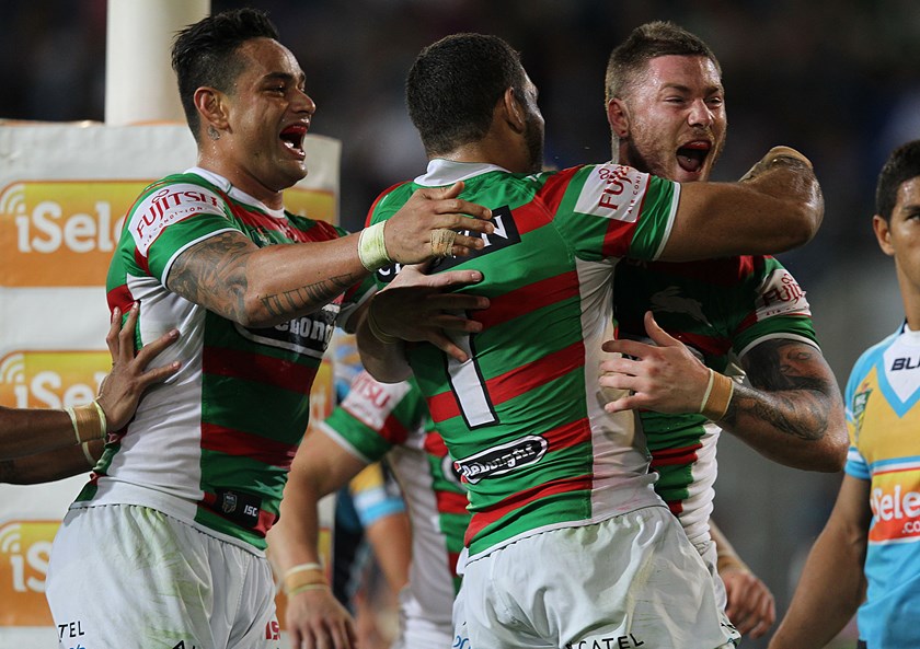 Chris McQueen celebrates with John Sutton and Greg Inglis