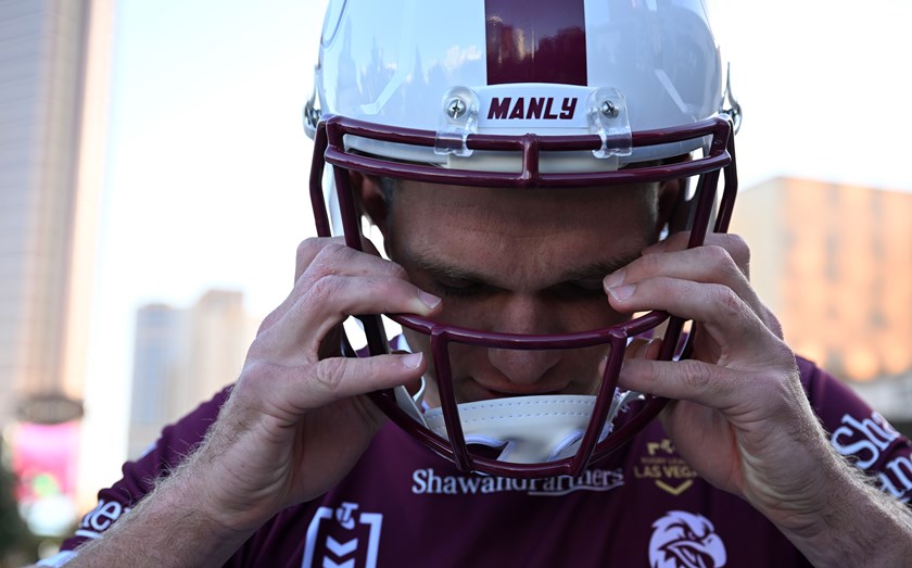 Tom Trbojevic tries on a specially made Manly Sea Eagles NFL helmut