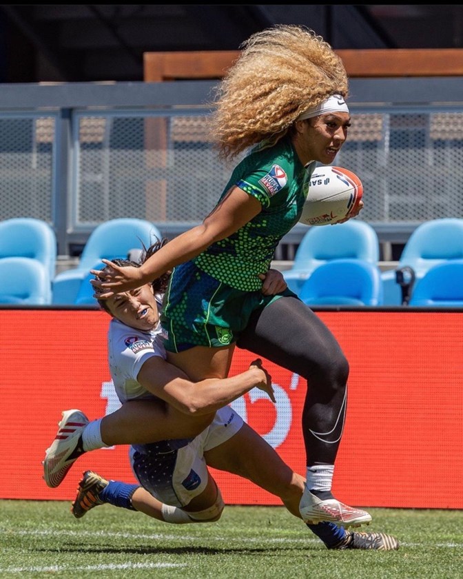 Liz Tafuna brushes off a tackler while playing for the SoCal Loggerheads