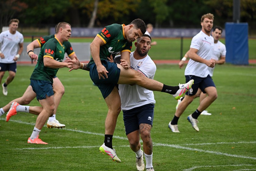 Nathan Cleary gets a kick away under pressure during the Kangaroos' scrimmage session against France in London.