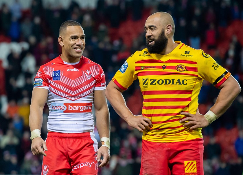 Samisoni Langi with former Tongan team-mate Will Hopoate after a Catalans-St Helens match. 