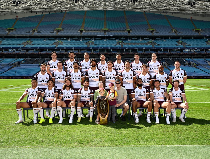 Ashton and his family join the Broncos for a very special team photo.
