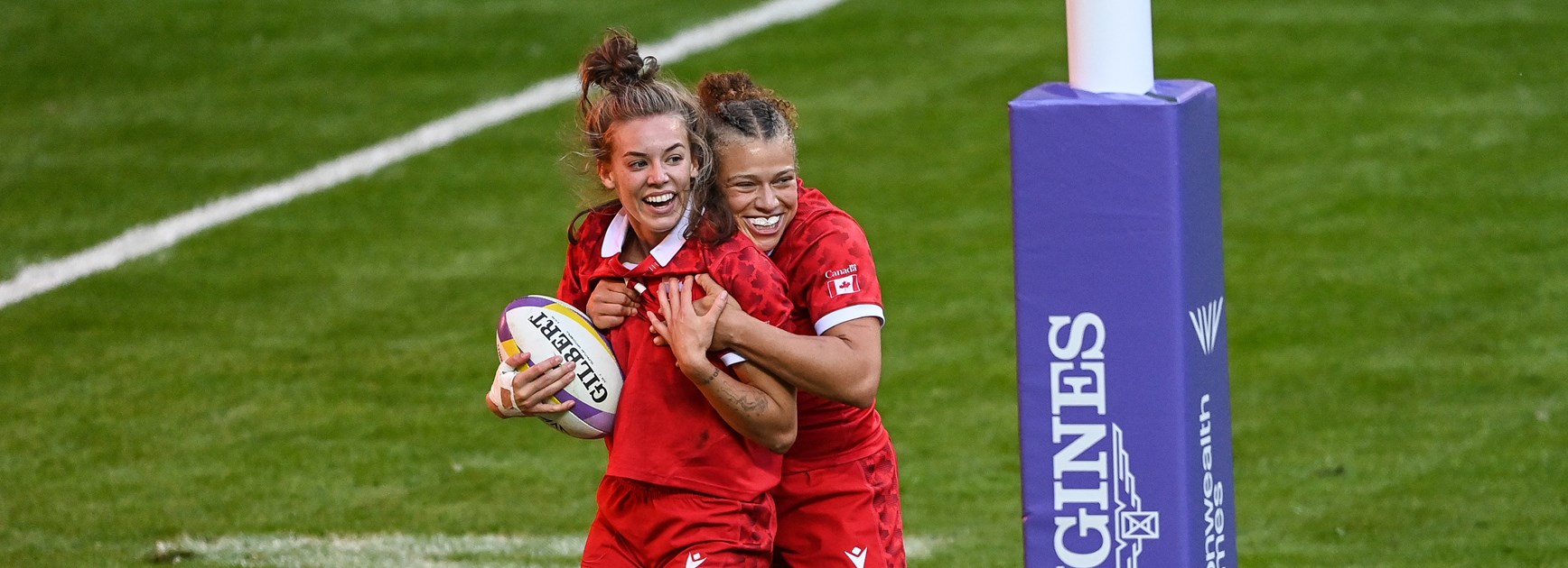 Renee Gonzalez celebrates with Piper Logan after a try in Canada's bronze medal 2022 Commonwealth Cup match against the Black Ferns.