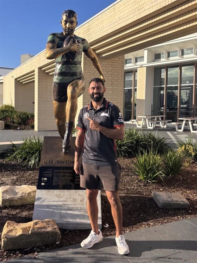 Alex Johnston with his statue at Rabbitohs headquarter after announcing he was joining the Chiefs.
