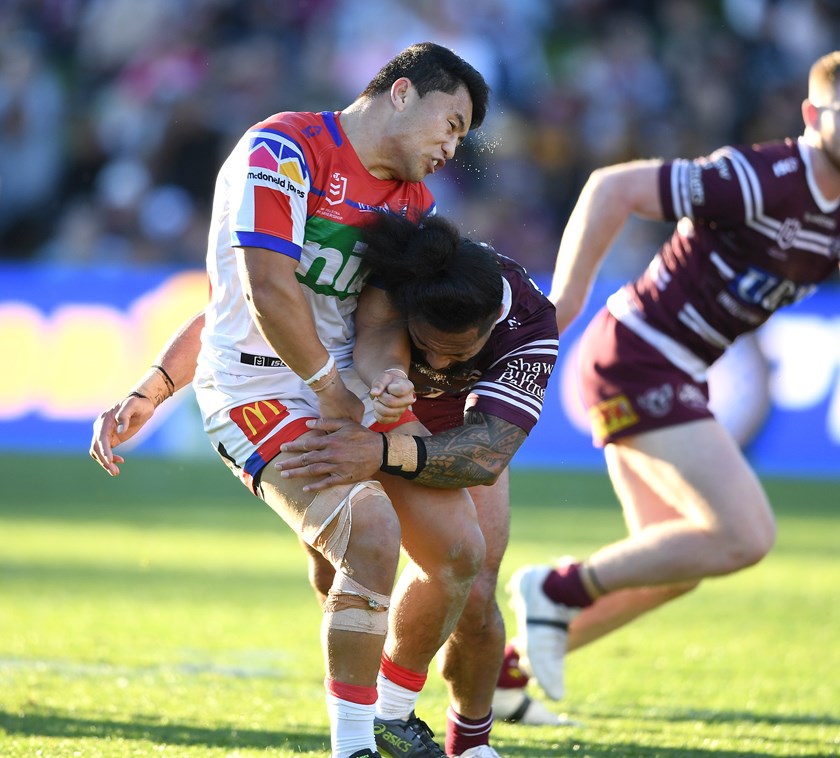 Manly's renowned hitman Jorge Taufua cleans up Mason Lino in 2019.
