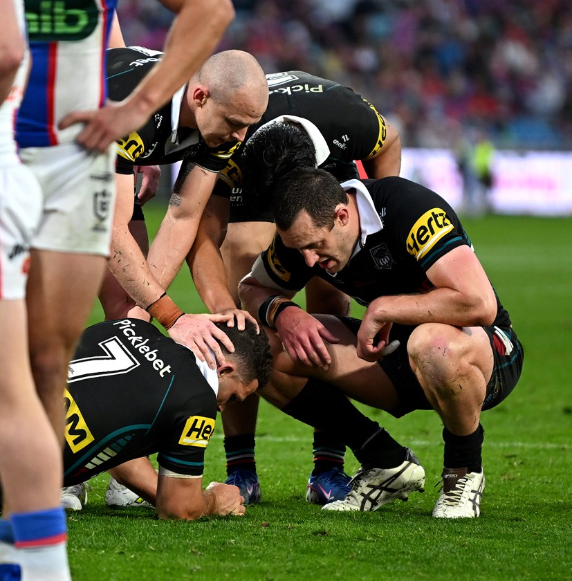 Panthers team-mates try to console Nathan Cleary after he suffered a compound fracture of his left ankle.