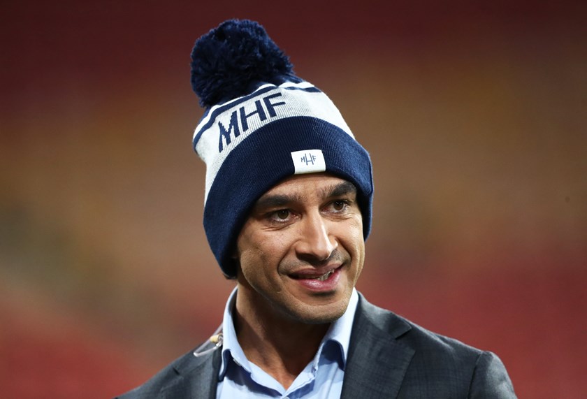 JT shows his support by donning a beanie at Suncorp Stadium in 2021 during a commentary stint.