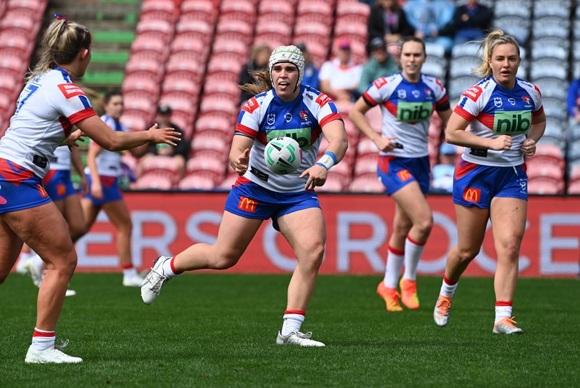 Jesse Southwell (centre) and Kirra Dibb (second from right) helped steer the Knights to glory in 2022.