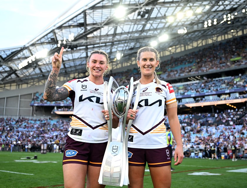 Shenae Ciesiolka celebrates the Broncos' 2025 premiership success with Julia Robinson.