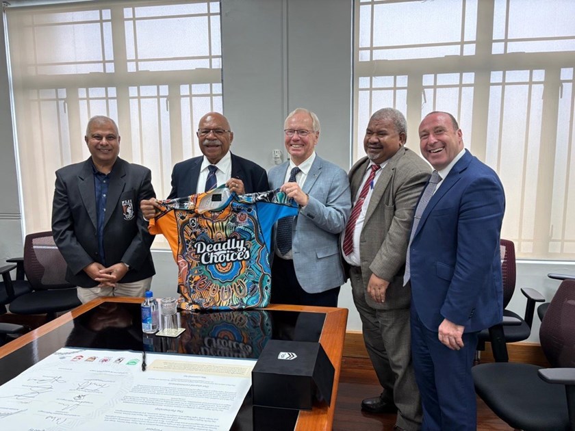 ARL Commissioner Peter Beattie presents Fiji PM Sitiveni Rabuka with a jersey after the signing of the Pacific Rugby League Partnership in Parliament.