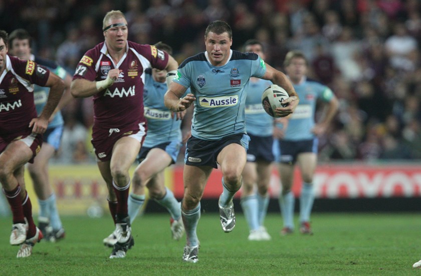 Anthony Watmough powers ahead for the Blues in 2009.