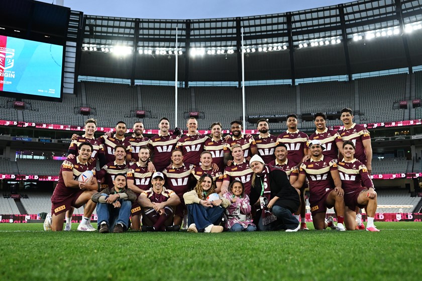 Makayla and her family share a special moment with the Maroons at the MCG.