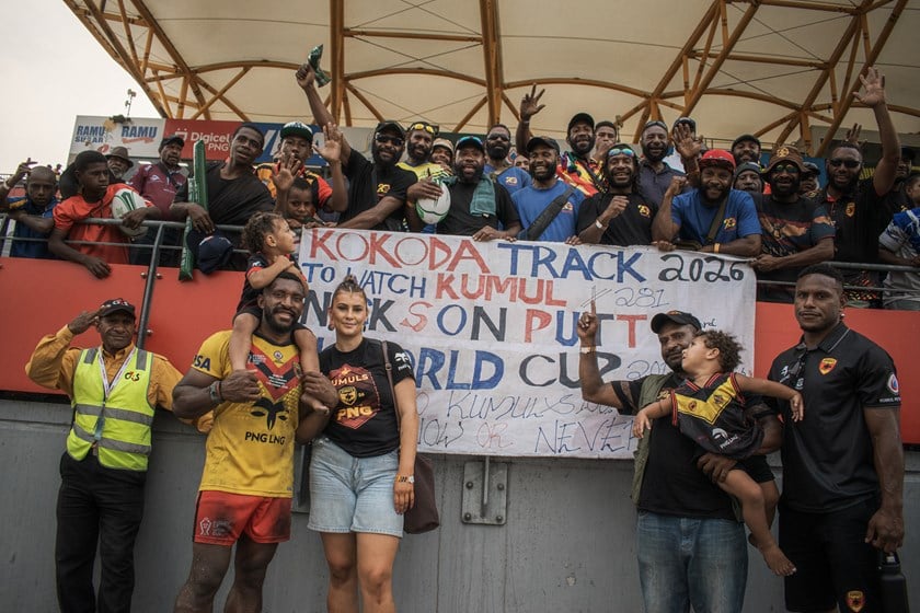 Nixon Putt and his wife Kyarna with the 25 tribesmen from Mt Hagen who walked Kokoda Track to watch him play in the World Cup.