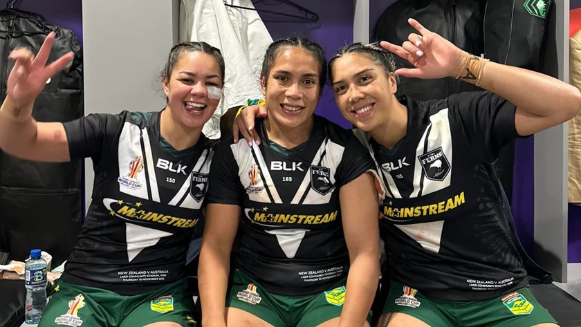 Kennedy Cherrington (l) and Shannon Mato (r) with Simaima Taufa after helping the Jillaroos to beat the Kiwi Ferns in the 2022 World Cup final. Cherrington and Mato are set to play for New Zealand at RLWC2026.