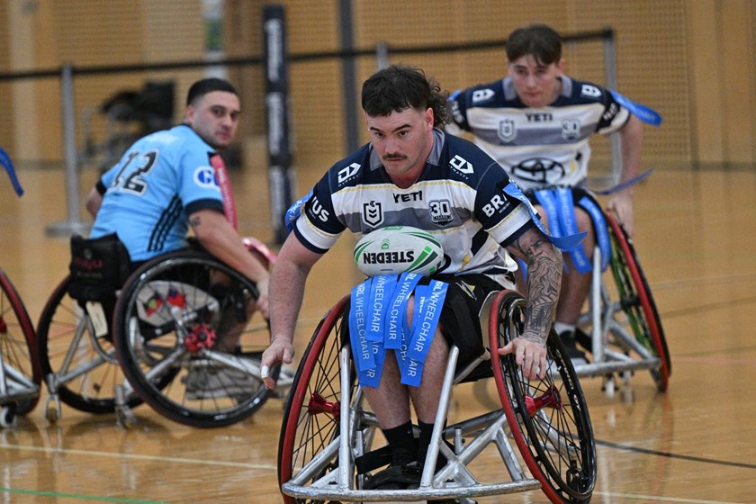 North Queensland star Bayley McKenna  on the way to one of his 18 tries at the LCA NRL Wheelchair Championship.