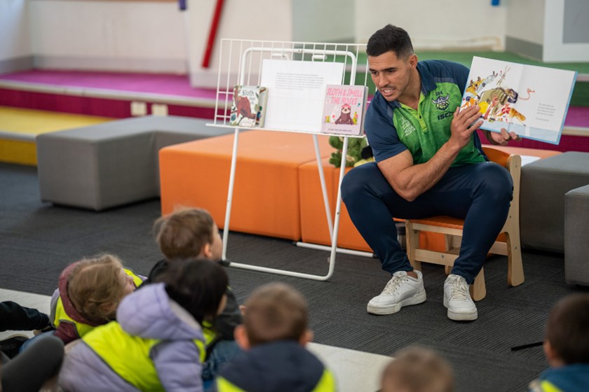 Jamal Fogarty reading to school kids.