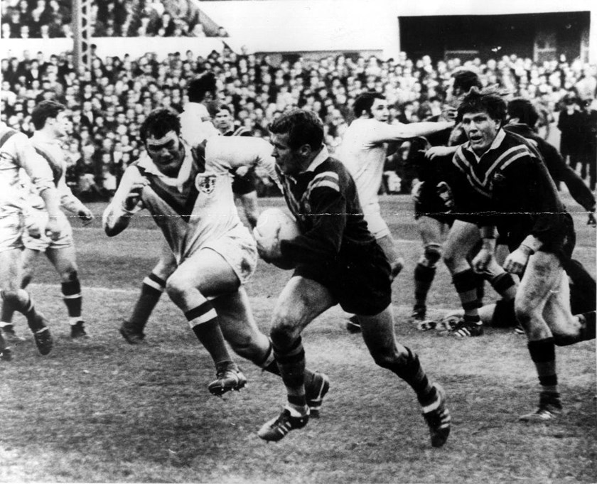 St George halfback Billy Smith tries to outpace British prop Cliff Watson during a match for Australia against Great Britain, 1970.