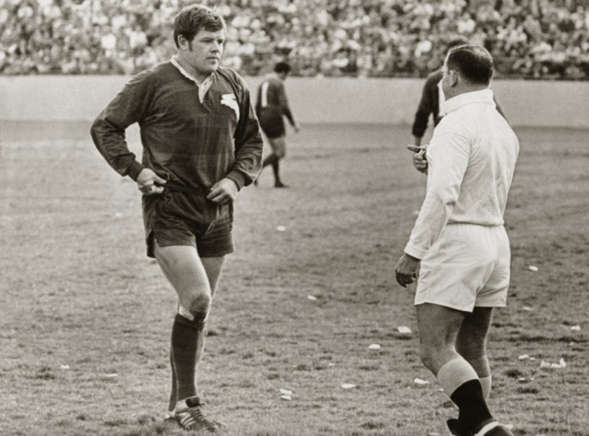 Bob McCarthy chats with referee Keith Holman in a match at the Sydney Sports Ground.