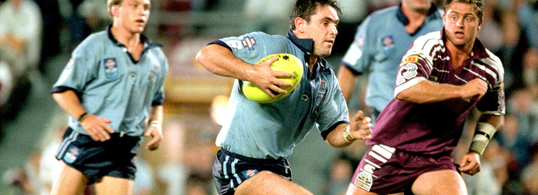 Brad Fittler looks to break away from the Maroons defence.