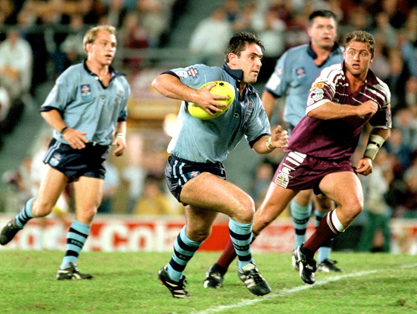 Brad Fittler looks to break away from the Maroons defence.