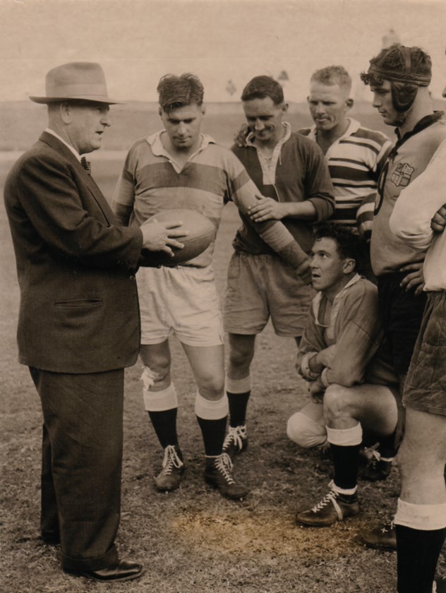 After retiring as a player Thompson (left holding the ball) became a renowned coach of multiple Bulimba Cup and Qld teams.