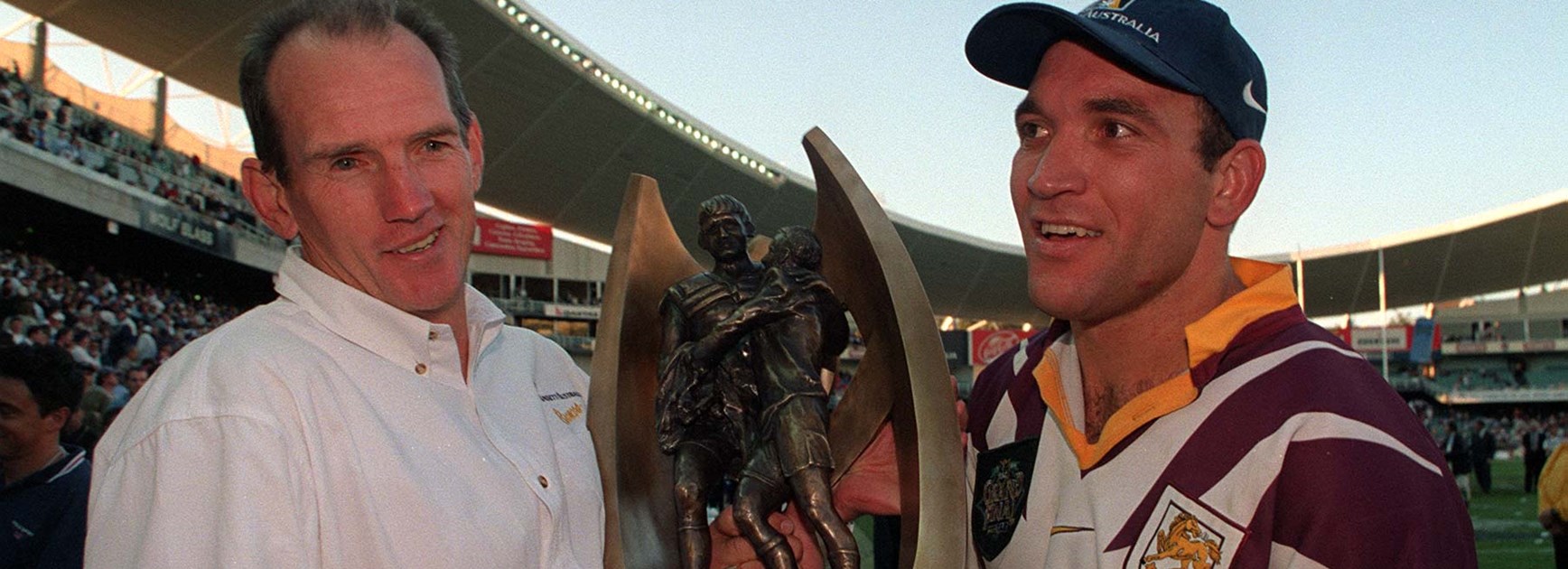 Gorden Tallis with Broncos coach Wayne Bennett after the Broncos' 1998 NRL Grand Final victory.