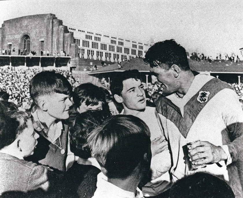 After fulltime of the 1965 Grand Final Provan talks to some young fans on field ahead of the presentation.